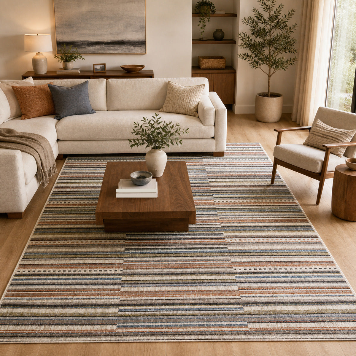 COD-41 Well Woven Thane Washable Rug - Warm modern living room with neutral seating, wood coffee table, and multicolor striped washable area rug.
