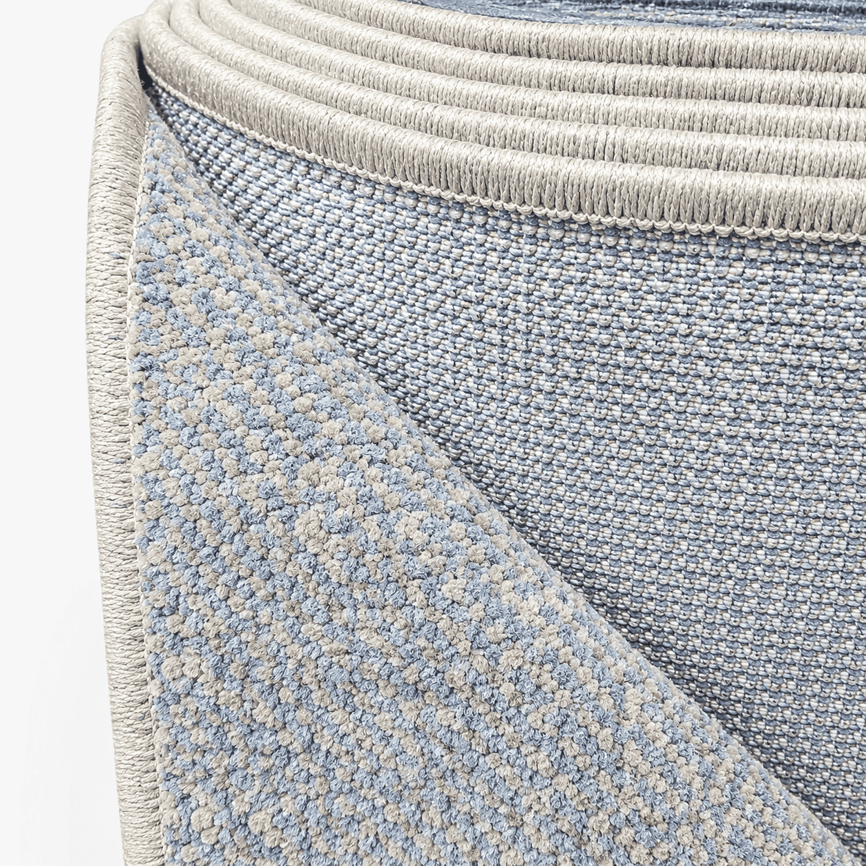 COD-17 - Long light blue and beige runner rug of a textured blue and gray rug corner
