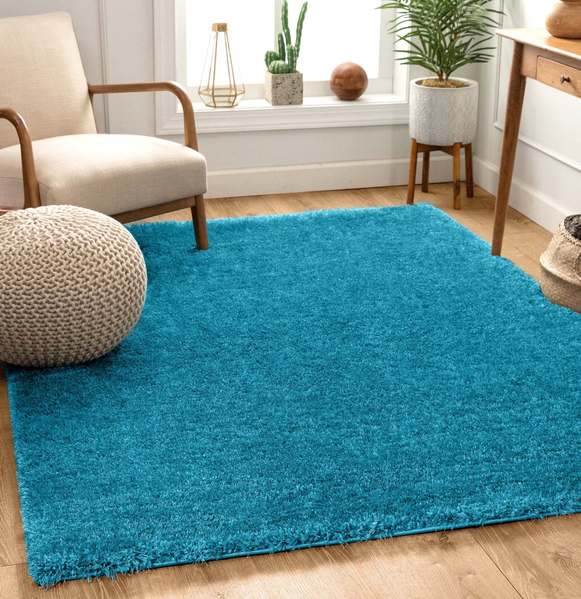 Feather Collection Liza Blue Shag Rug – Sparkly, Plush, Minimalist Glam - Well Woven - Soft teal rug in a living room