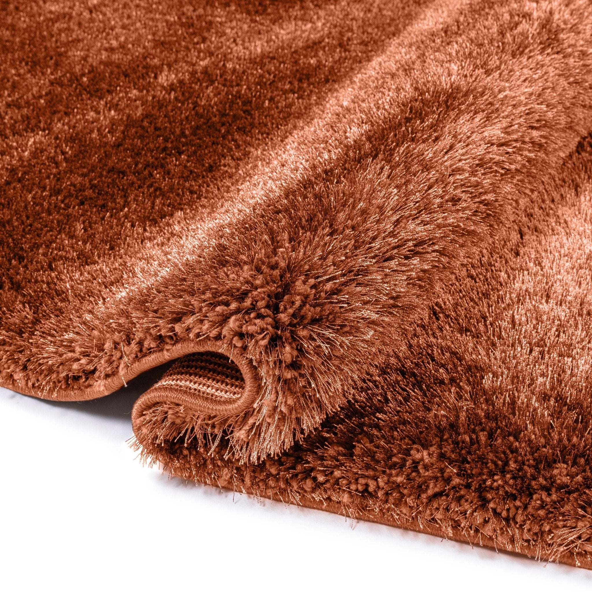 A detail image of the Feather Collection Liza Terracotta Shag Rug