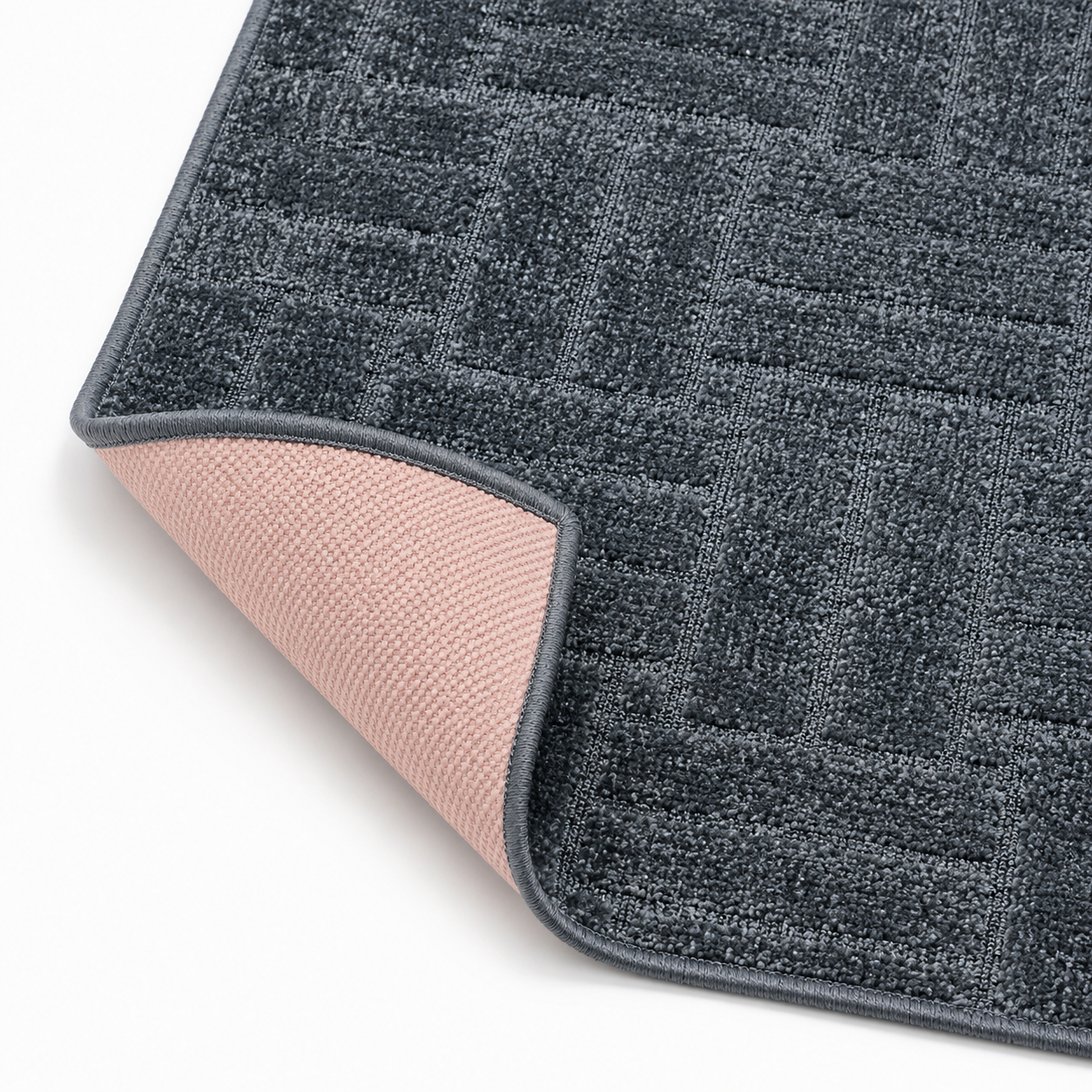 Serenity Soft Parquet Midnight runner rug flipped corner showing the rubber backing