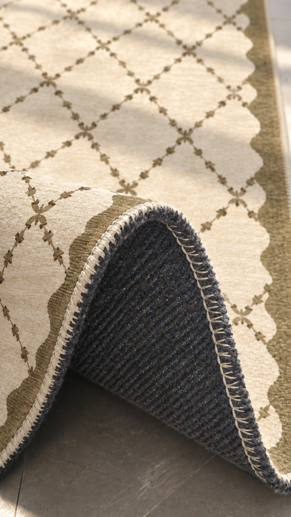Apollo Petal Arc Area Rug — Olive Brown / Cream — folded rug detail in soft afternoon light. Digital visualization.