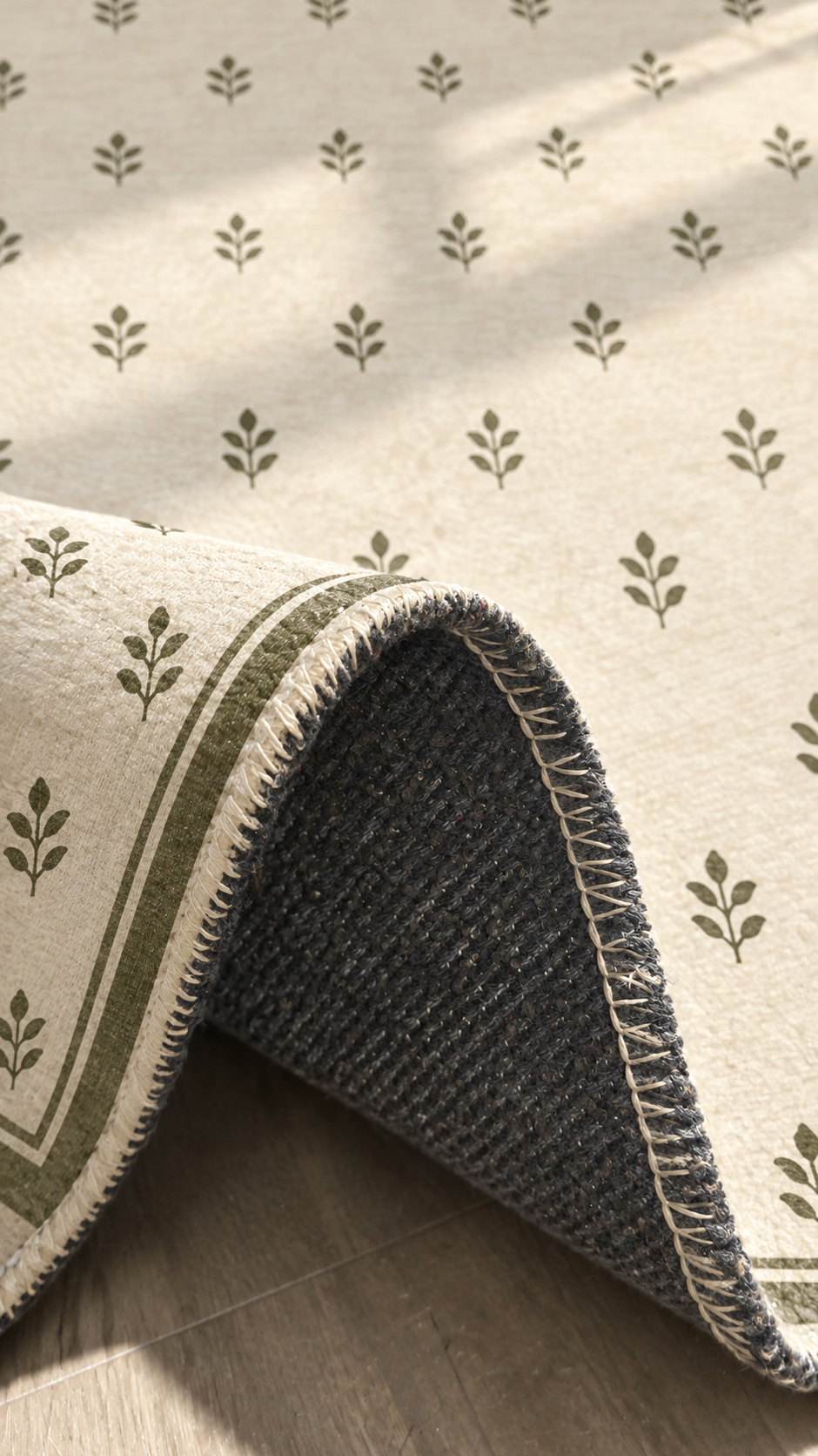 Apollo Little Orchard Area Rug — Olive / Cream — folded rug detail in soft afternoon light. Digital visualization.