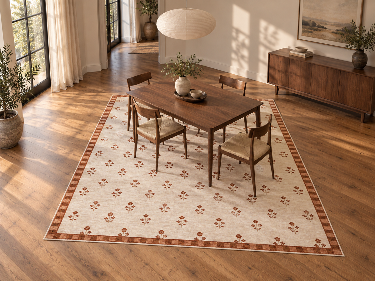 Apollo Posy Walk Area Rug — Terracotta / Beige — dining room in soft afternoon light. Digital visualization.