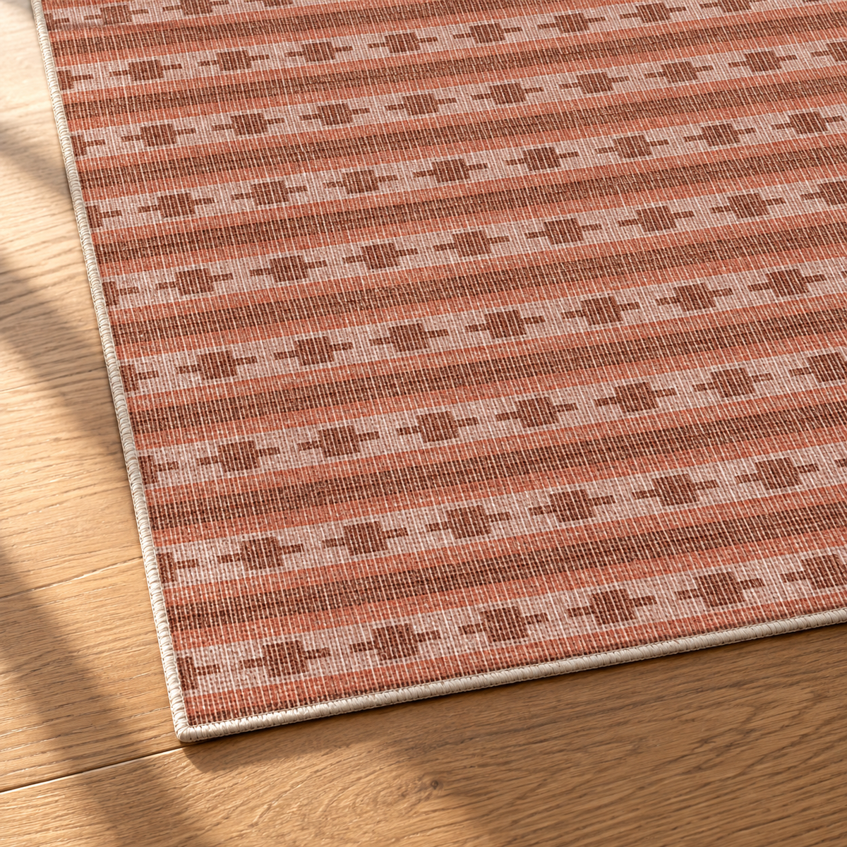 Apollo Keepsake Stripe Area Rug — Terracotta / Light Terracotta — corner and edge detail in soft afternoon light. Digital visualization.
