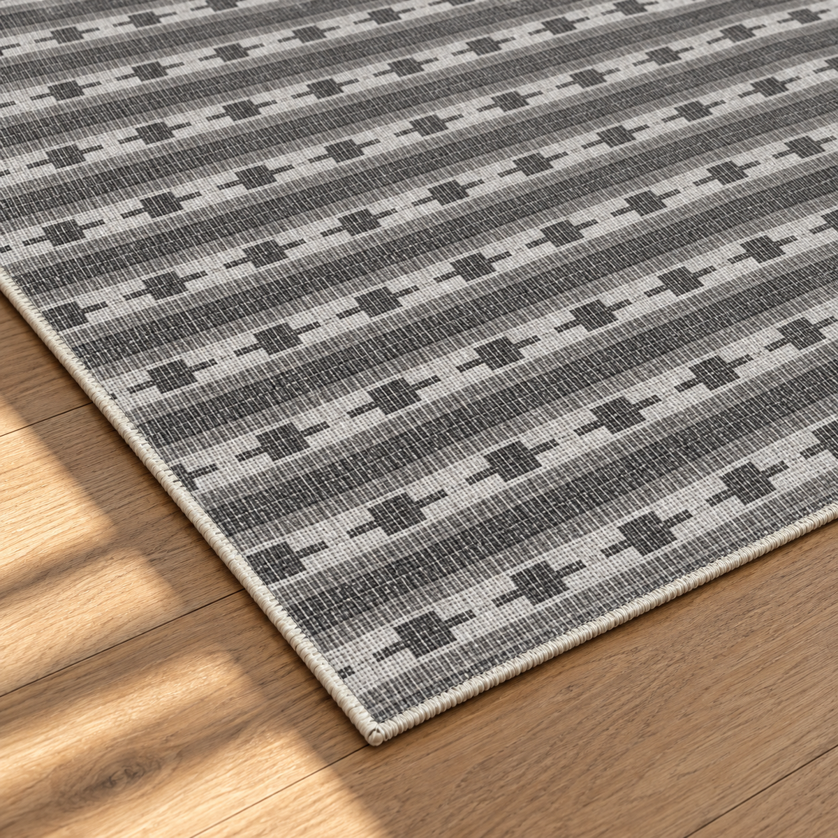 Apollo Keepsake Stripe Area Rug — Charcoal / Light Gray — corner and edge detail in soft afternoon light. Digital visualization.