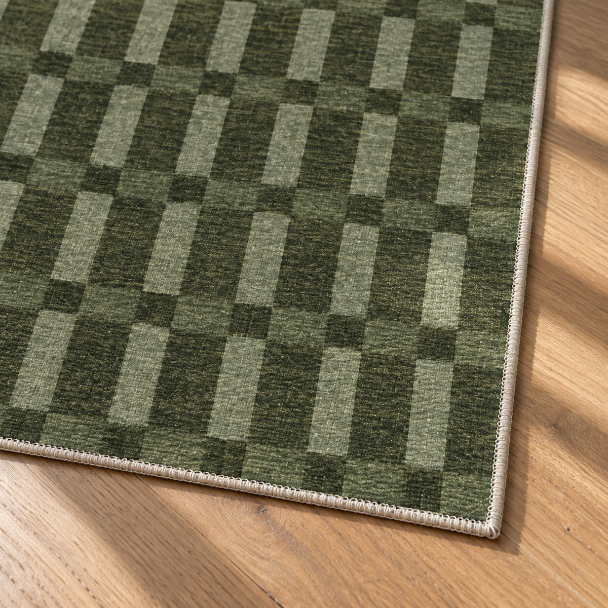 Apollo Pavilion Step Area Rug — Green / Sage — corner and edge detail in soft afternoon light. Digital visualization.