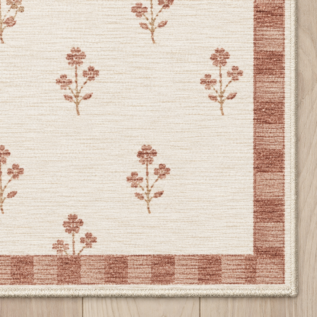 Top-down Apollo Posy Walk in Dusty Rose / Cream: chenille corner and cream serged edge — digital material visualization, not a finished-rug photograph.