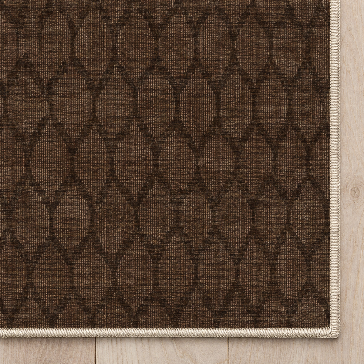 Top-down Apollo Brackenline in Espresso / Beige: chenille corner and cream serged edge — digital material visualization, not a finished-rug photograph.