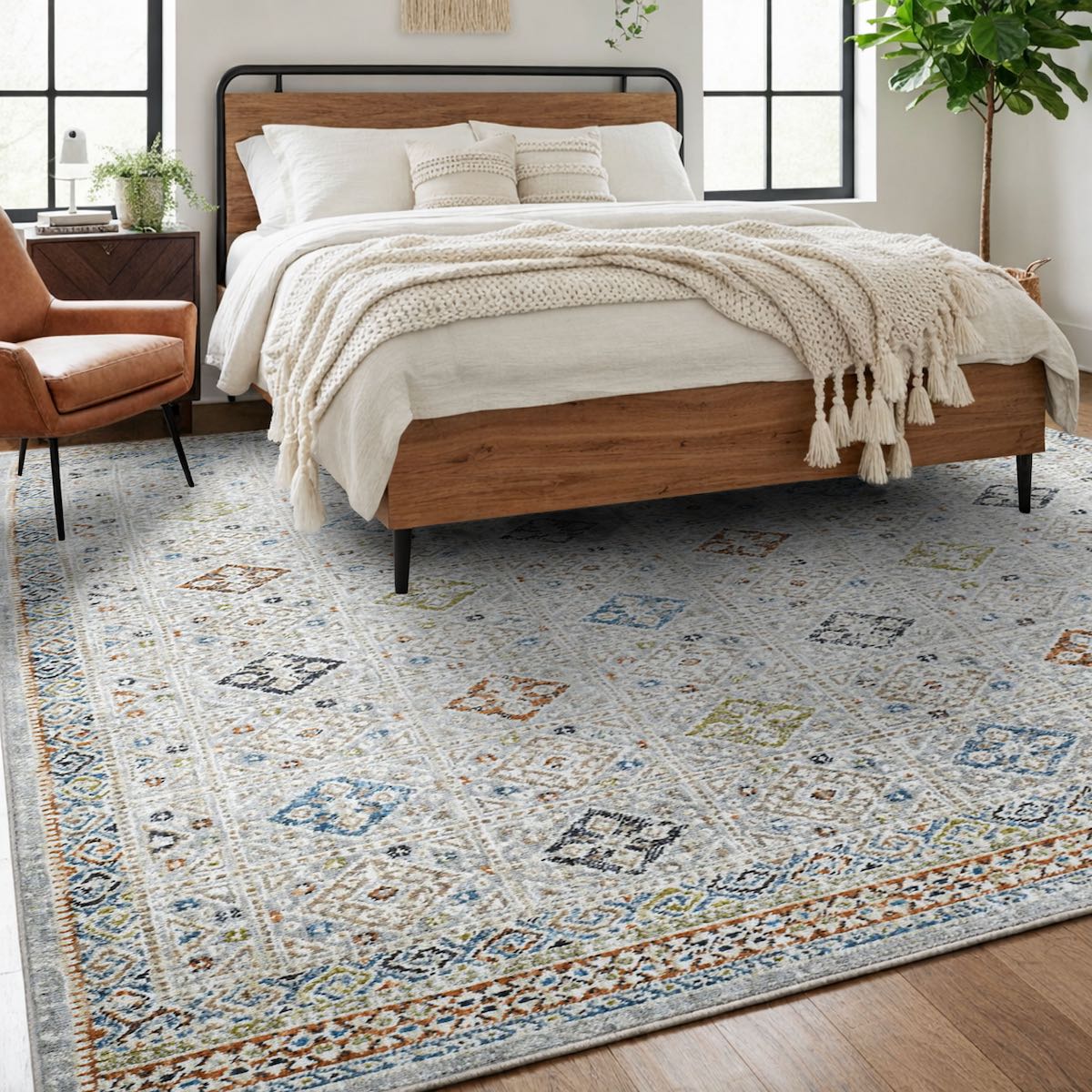 COD-21 Well Woven Mere Washable Rug -  Bedroom with a wooden bed, white bedding, and a patterned tribal rug.
