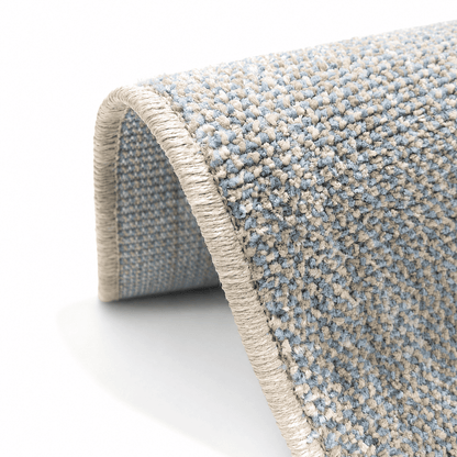 COD-17 - Long light blue and beige runner rug Close-up of a textured blue and beige rug with a white background