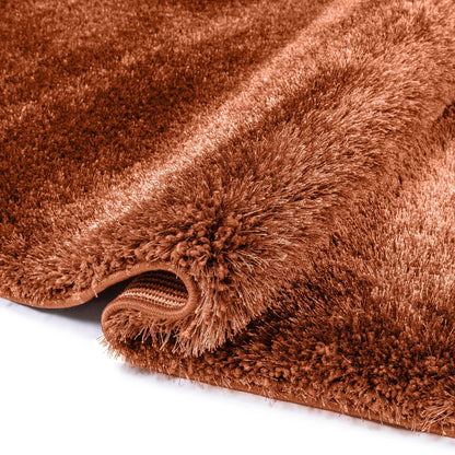 A detail image of the Feather Collection Liza Terracotta Shag Rug