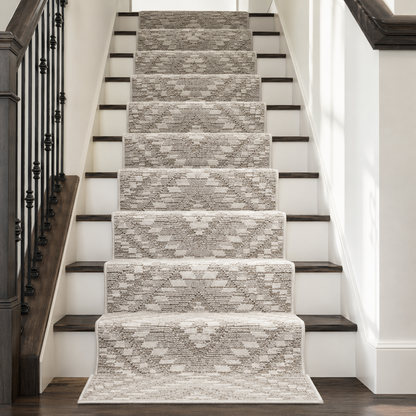 A set of nine stair runner rugs with a textured geometric diamond pattern in beige and gray, shown installed on a staircase with dark wood treads and white walls.