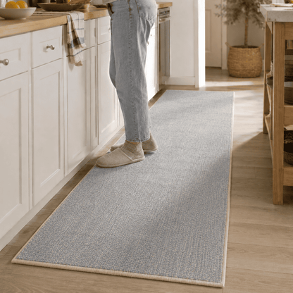 COD-17 - Long light blue and beige runner rug on a wooden floor  in a kitchen.