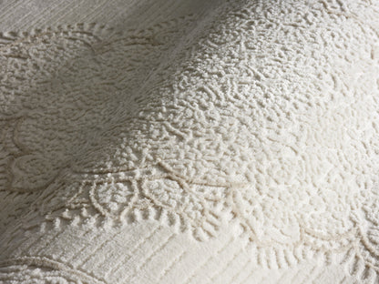 Lafayette Crest ivory and cream medallion area rug, close-up of the high-and-low woven pile