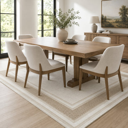 Lafayette Key cream and beige Greek key border area rug under a dining table