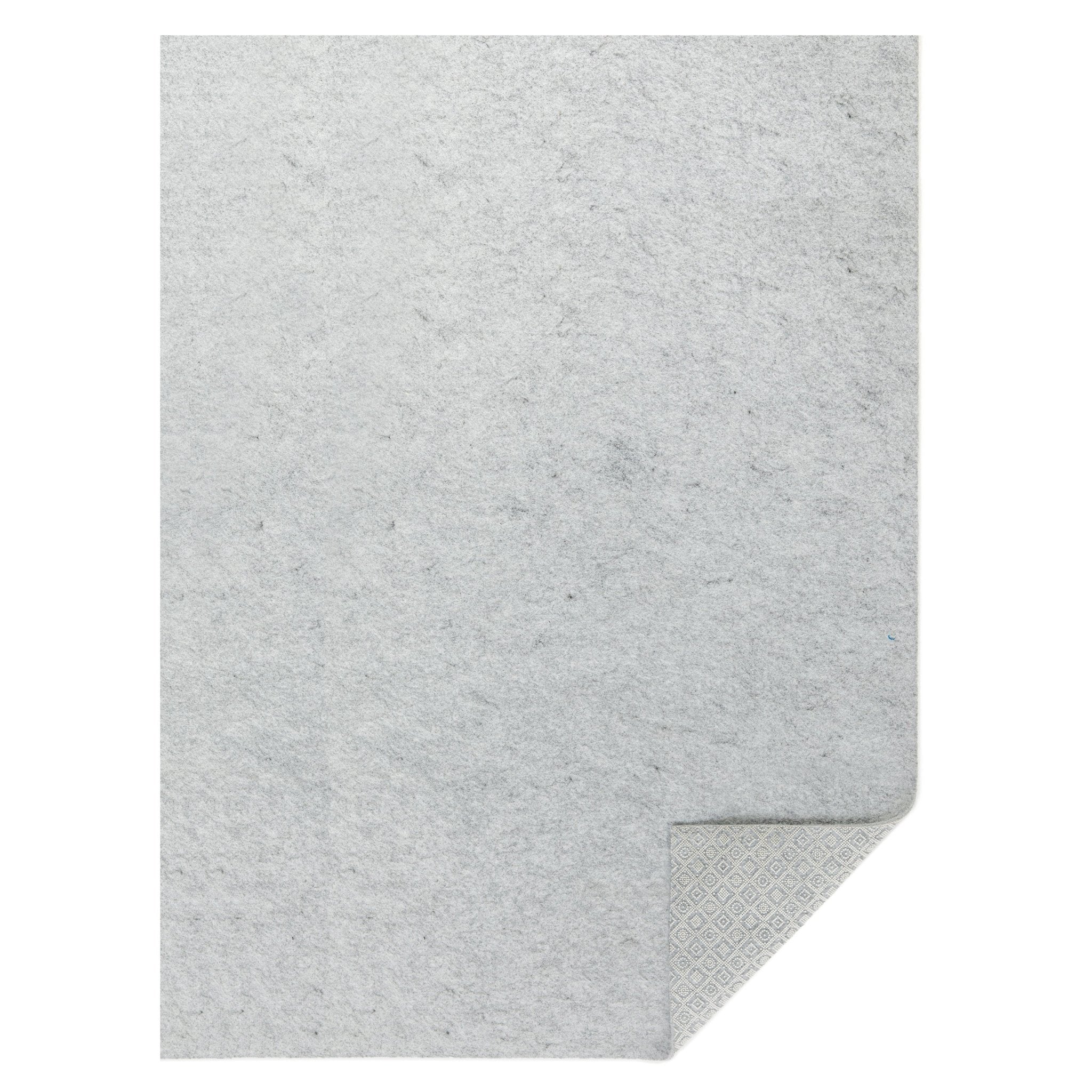 The Well Woven Premium Felt Non-Slip runner rug pad on a white background. The bottom right corner is flipped up to show its non-slip grip.