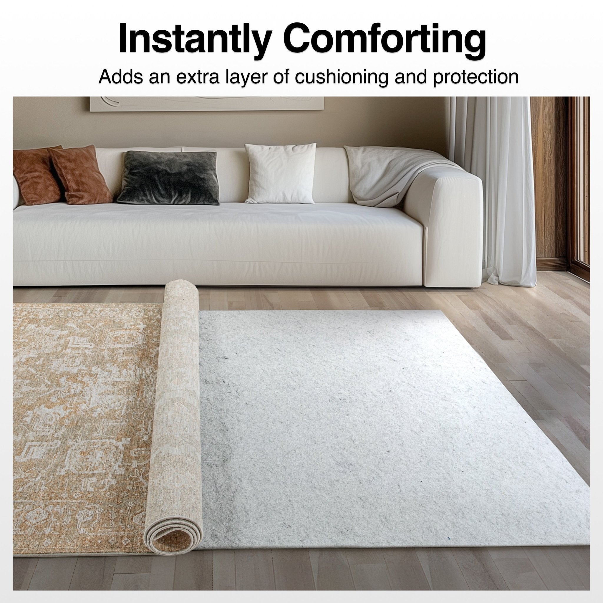 Beige Echo Harmony Area Rug being unrolled in a living room with a couch and pillows. Below it is the Well Woven Premium Felt Non-Slip Rug Pad adding extra comfort and protection to the wood floors below