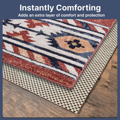 Elle Basics PVC Non-Slip Rug Pad  - Decorative red rug with a geometric pattern on a PVC rug pad resting on a wooden floor, text reads 'Instantly Comforting: Adds an extra layer of comfort and protection' above.