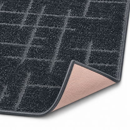 Serenity Soft Linen Midnight runner rug flipped corner showing the rubber backing