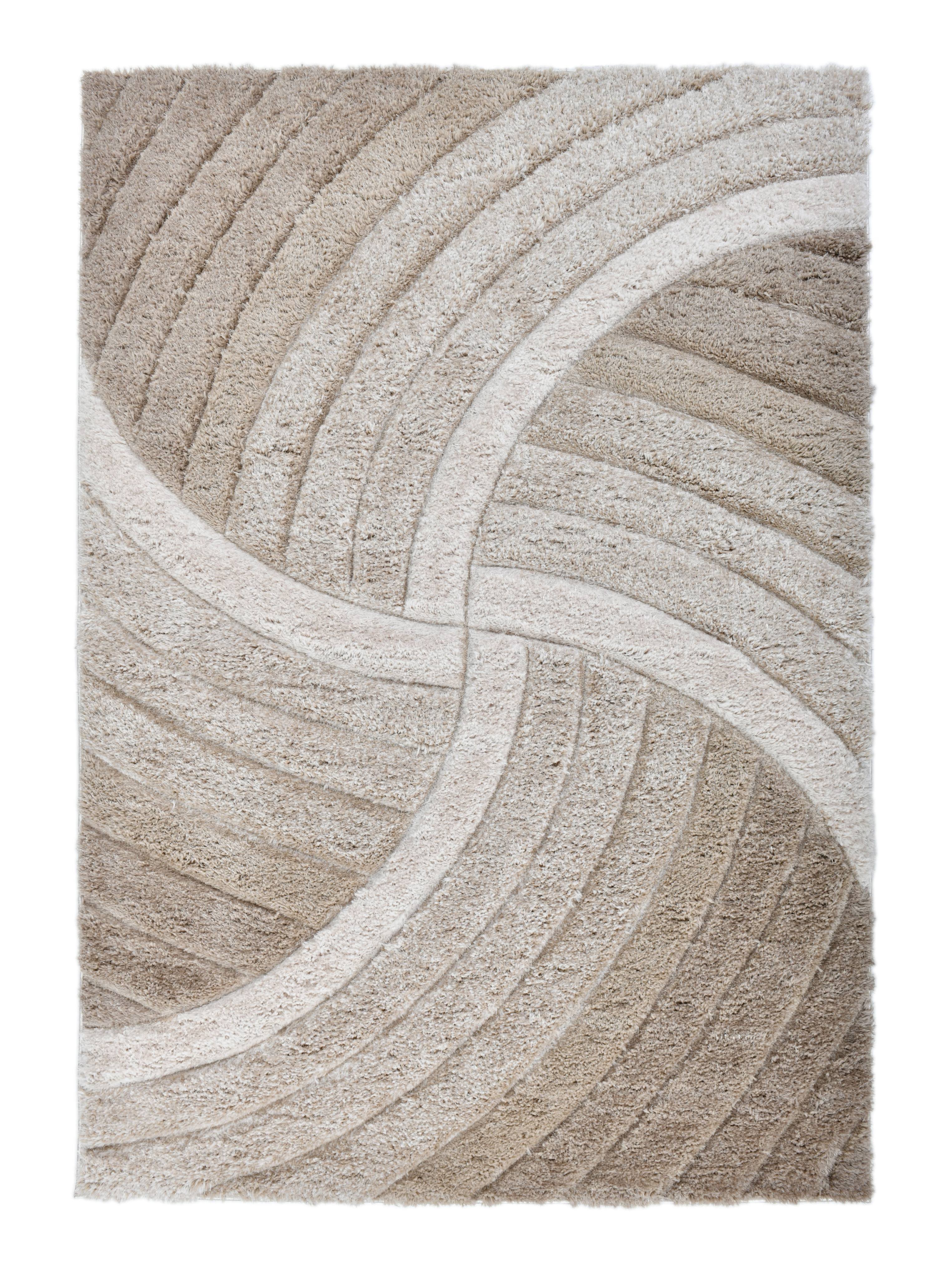 Overhead view of the Ucci beige geometric shag rug with carved ivory wave lines