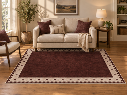 Apollo Evening Frame Area Rug — Burgundy / Cream — living room in soft afternoon light. Digital visualization.