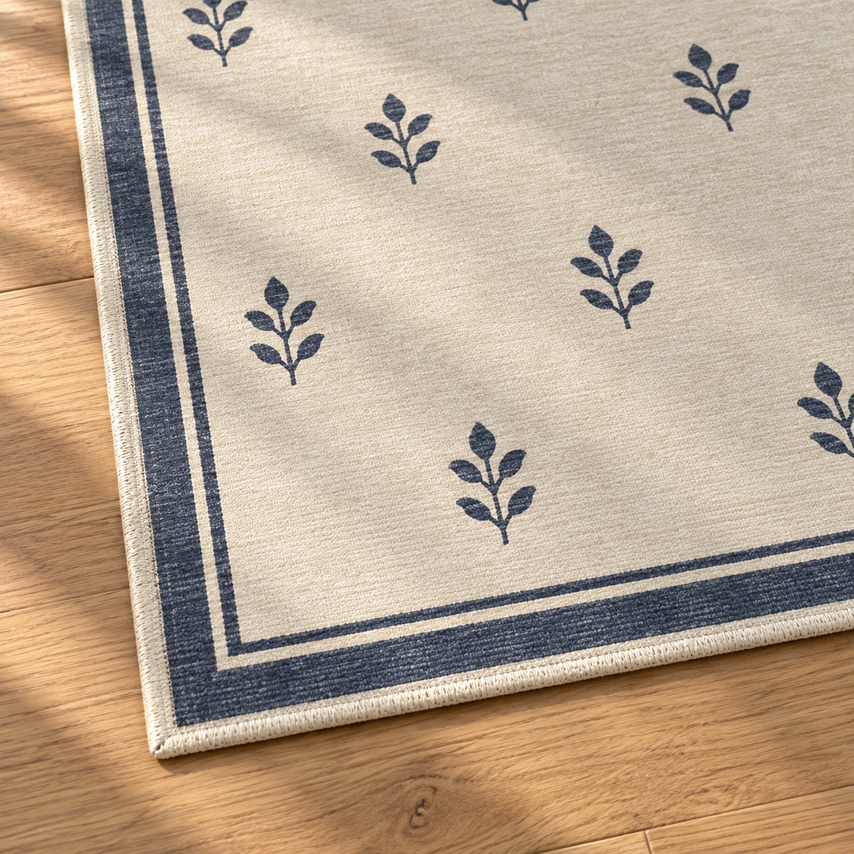 Apollo Little Orchard Area Rug — Navy / Cream — corner and edge detail in soft afternoon light. Digital visualization.
