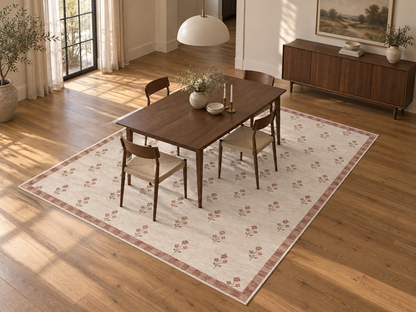 Apollo Posy Walk Area Rug — Dusty Rose / Cream — dining room in soft afternoon light. Digital visualization.