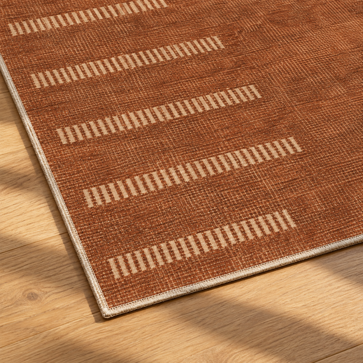 Apollo Interval Row Area Rug — Terracotta / Beige — corner and edge detail in soft afternoon light. Digital visualization.