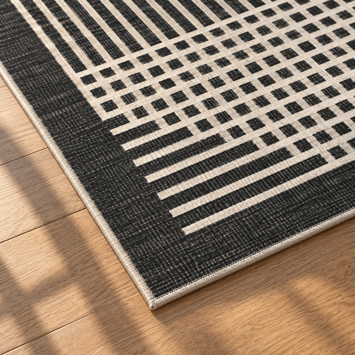 Apollo Crossline Study Area Rug — Charcoal / Cream — corner and edge detail in soft afternoon light. Digital visualization.