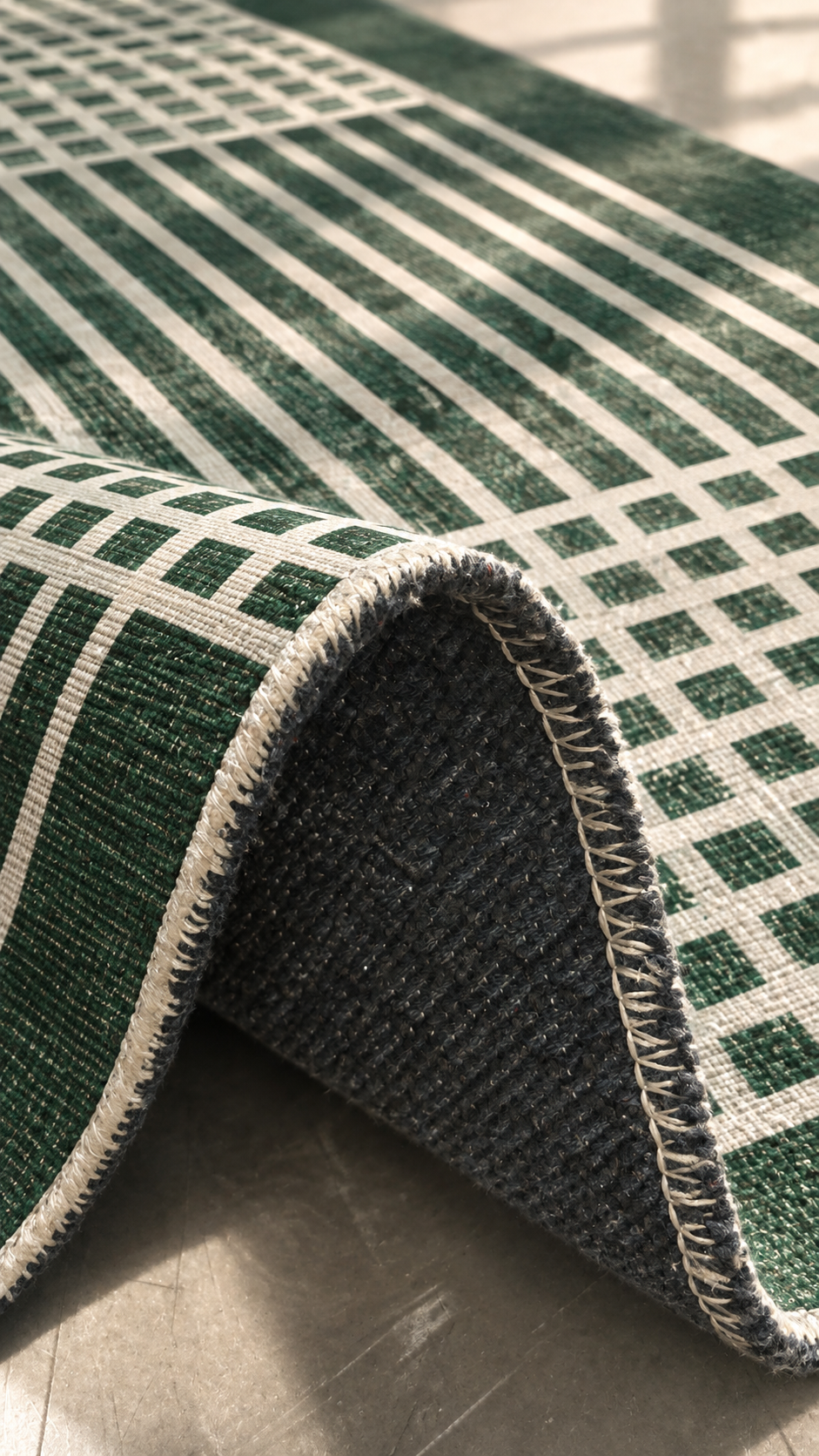 Apollo Crossline Study Area Rug — Pine Green / Cream — folded rug detail in soft afternoon light. Digital visualization.