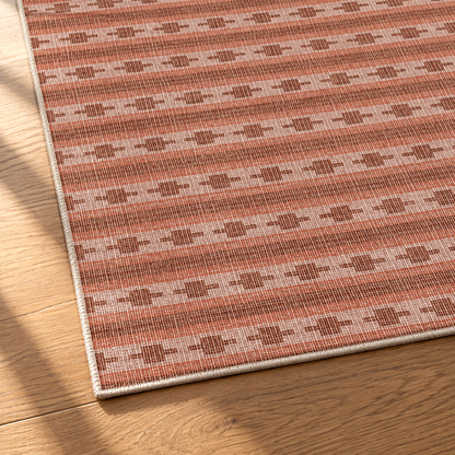 Apollo Keepsake Stripe Area Rug — Terracotta / Light Terracotta — corner and edge detail in soft afternoon light. Digital visualization.