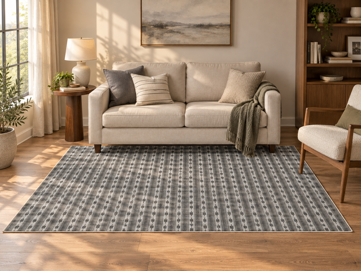 Apollo Keepsake Stripe Area Rug — Charcoal / Light Gray — living room in soft afternoon light. Digital visualization.