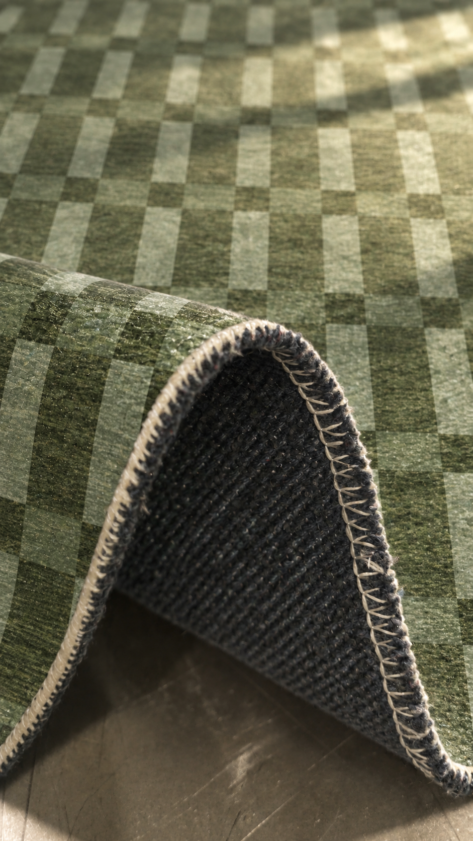 Apollo Pavilion Step Area Rug — Green / Sage — folded rug detail in soft afternoon light. Digital visualization.