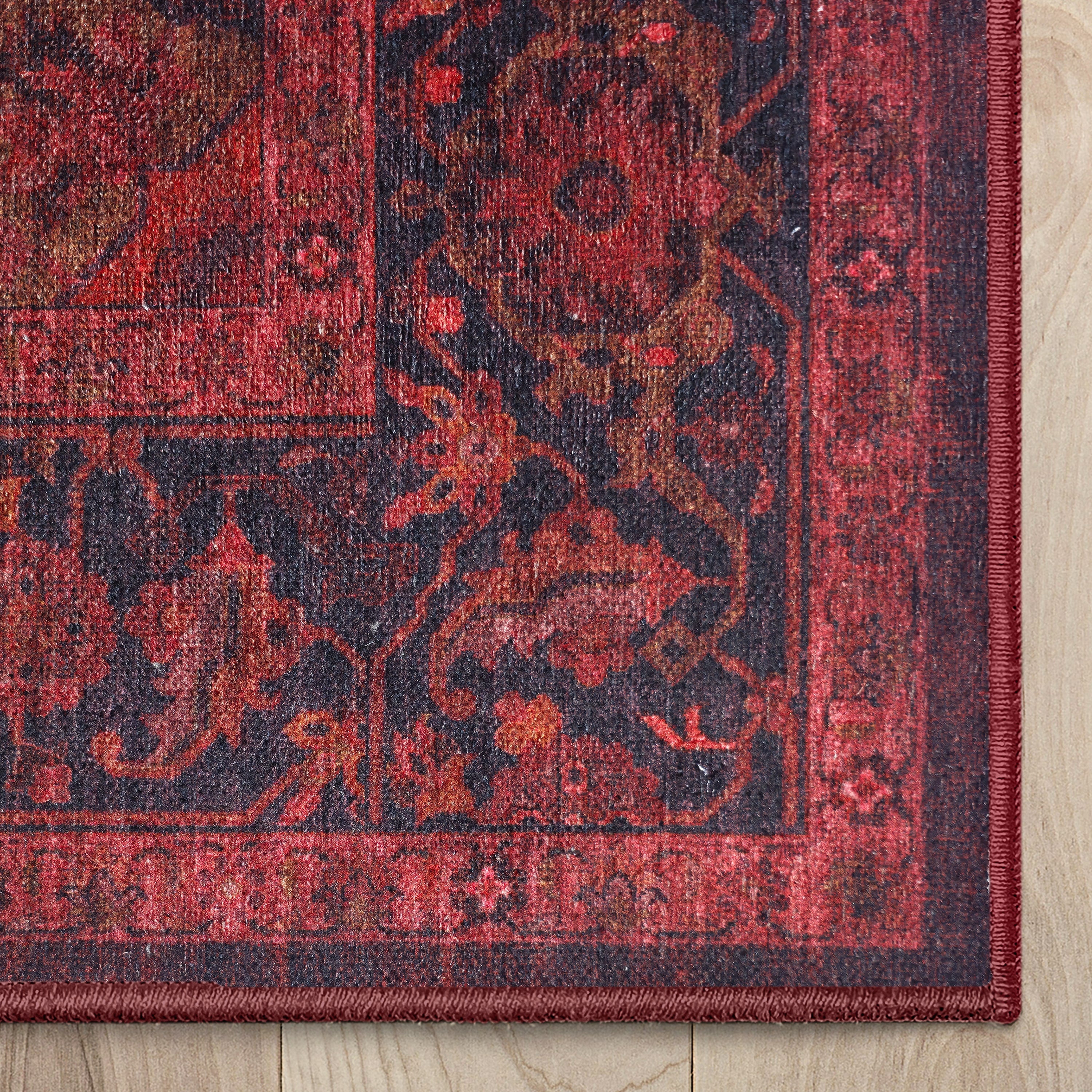 Apollo Ember Court Oxblood Red Medallion Washable Rug — corner and edge finish