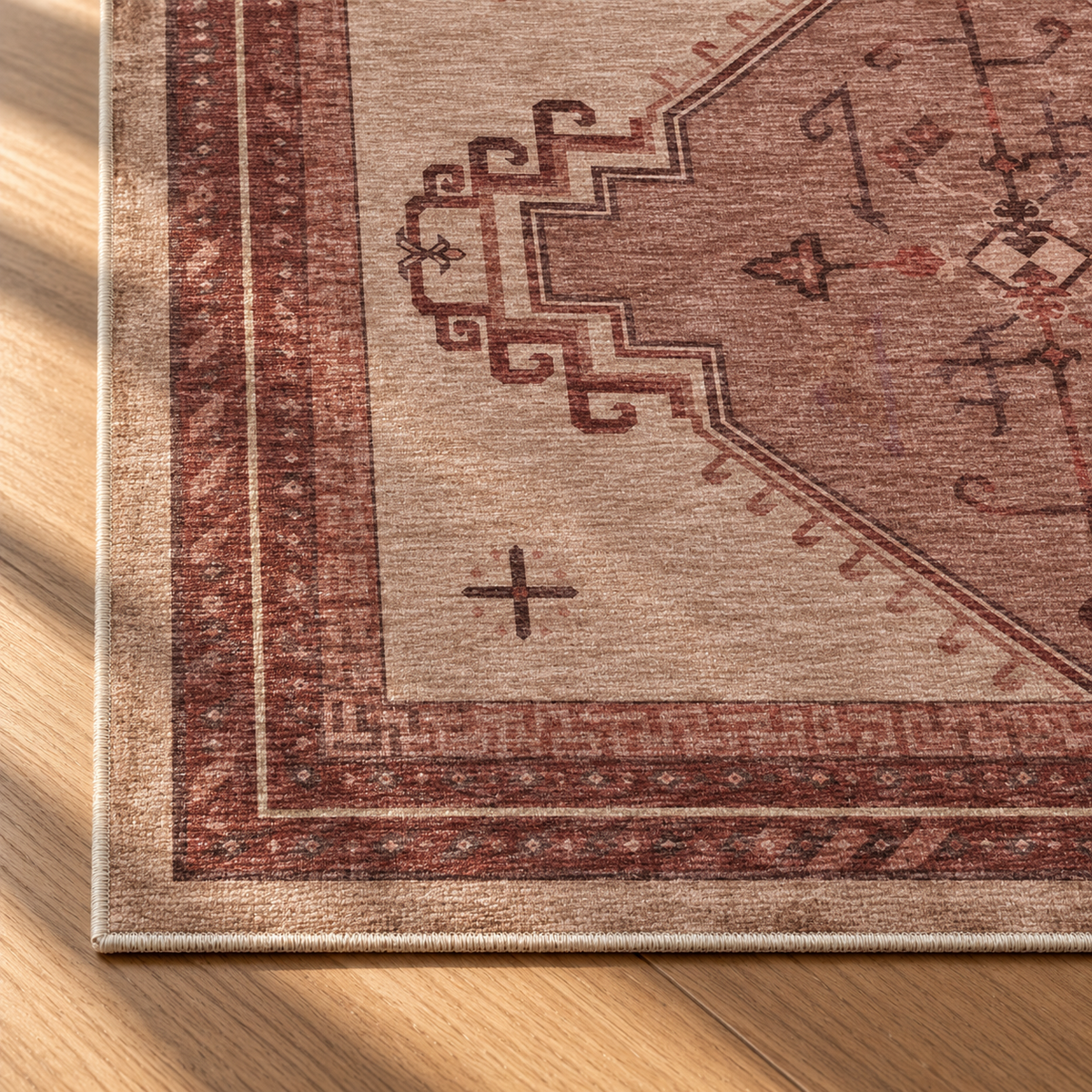 Apollo Wayfarer Court Area Rug — Dusty Burgundy / Beige — corner and edge detail in soft afternoon light. Digital visualization.