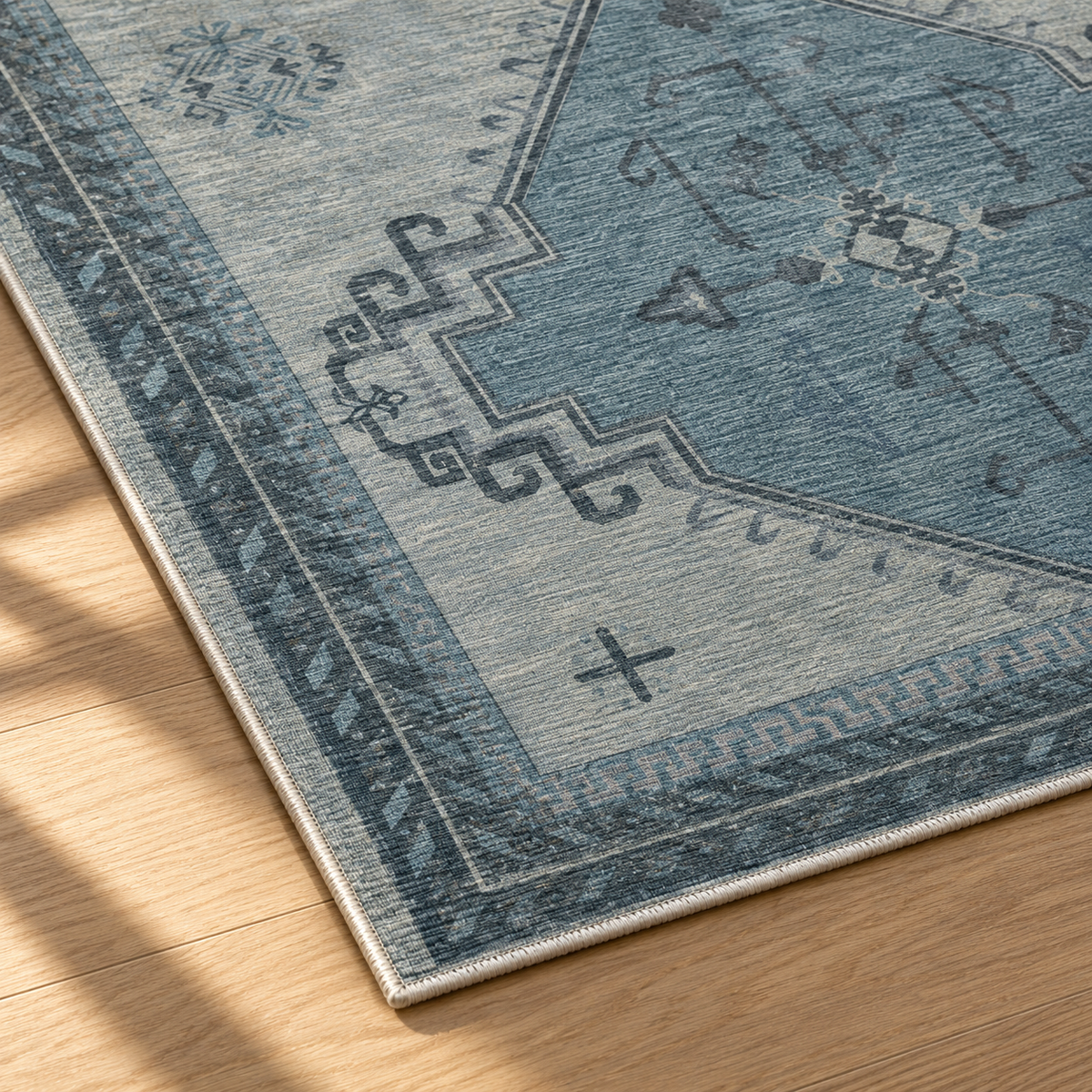 Apollo Wayfarer Court Area Rug — Petrol Blue / Beige — corner and edge detail in soft afternoon light. Digital visualization.
