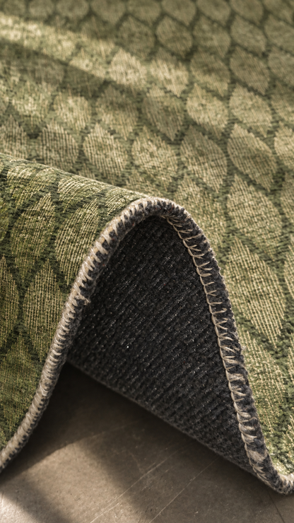 Apollo Brackenline Area Rug — Olive / Beige — folded rug detail in soft afternoon light. Digital visualization.