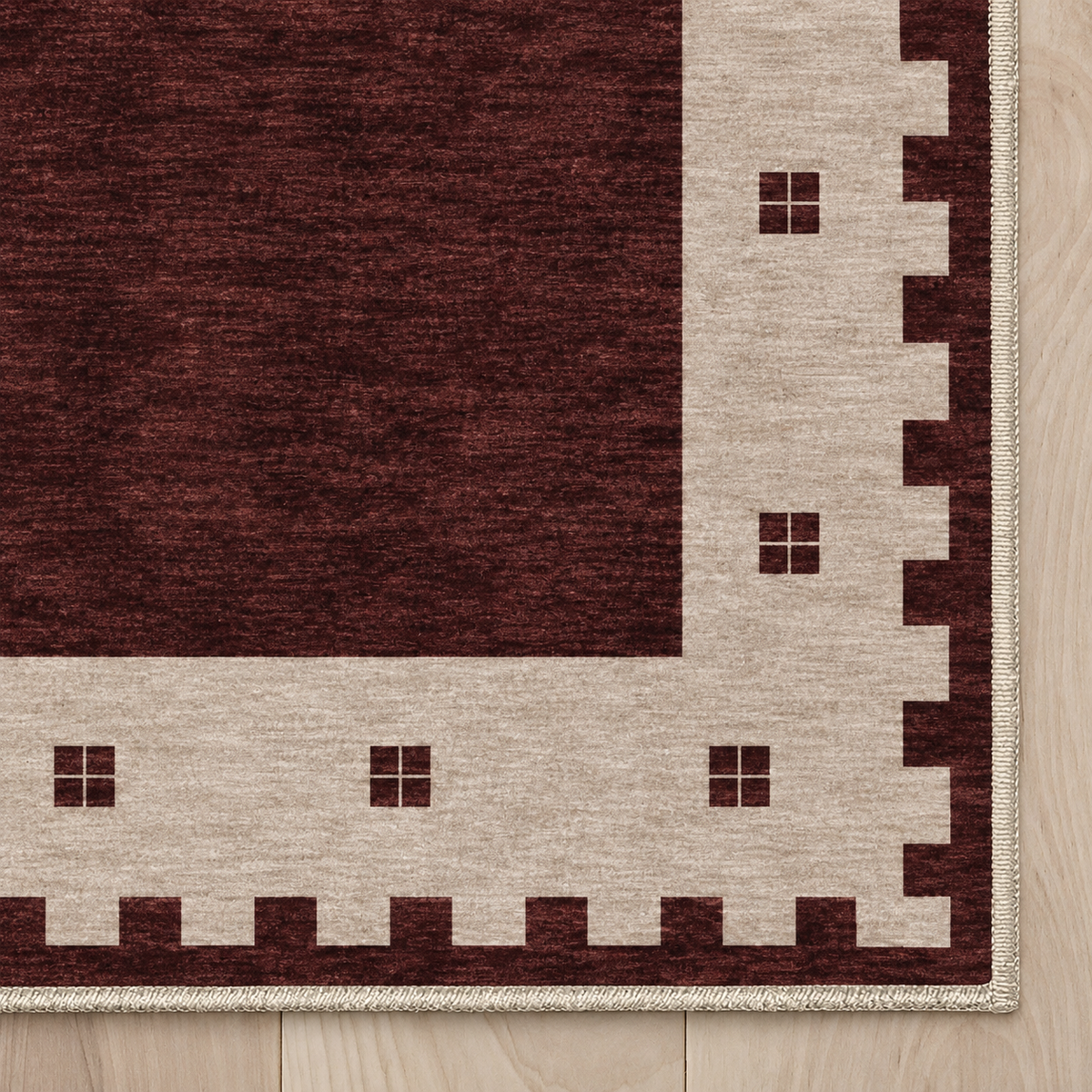 Top-down Apollo Evening Frame in Burgundy / Cream: chenille corner and cream serged edge — digital material visualization, not a finished-rug photograph.