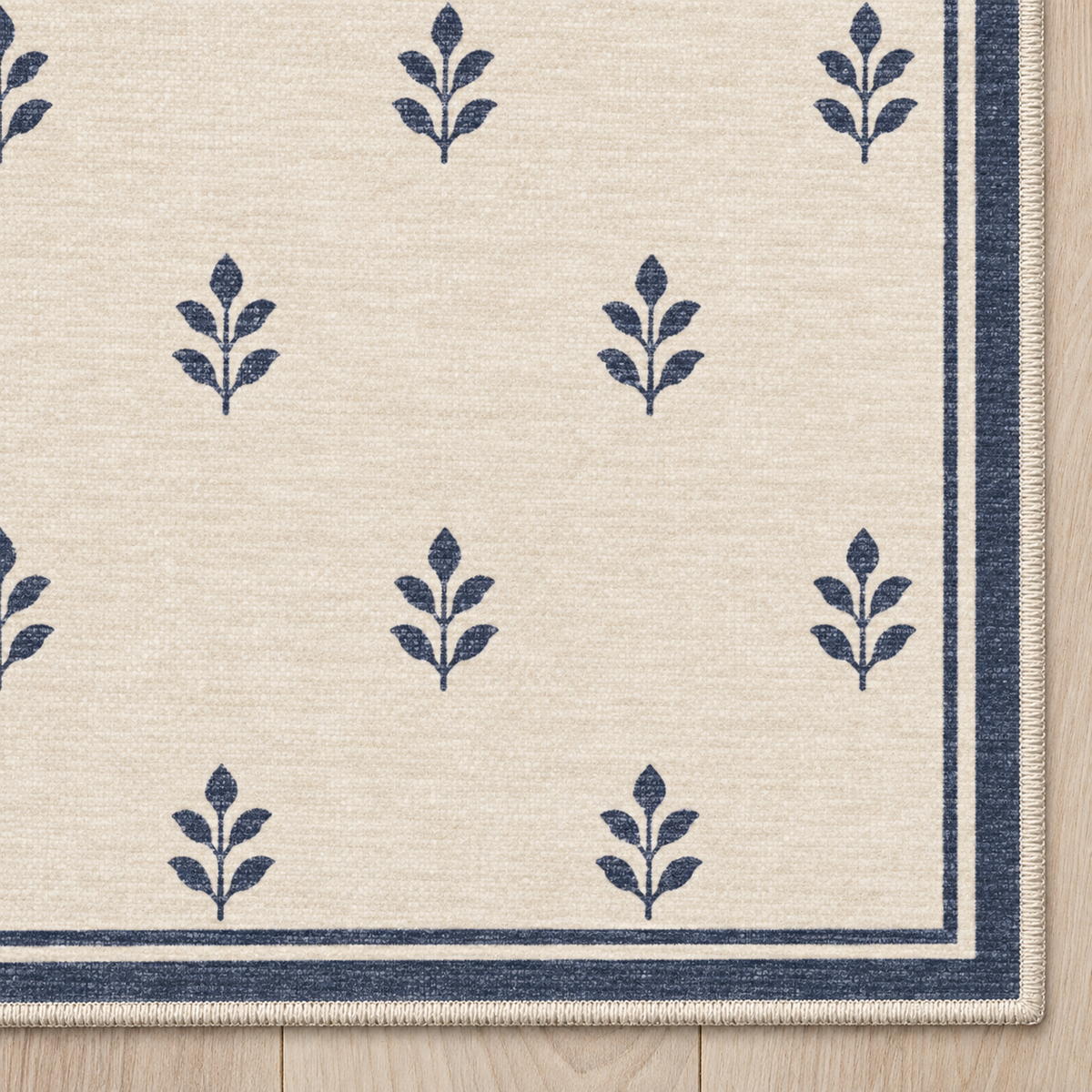 Top-down Apollo Little Orchard in Navy / Cream: chenille corner and cream serged edge — digital material visualization, not a finished-rug photograph.
