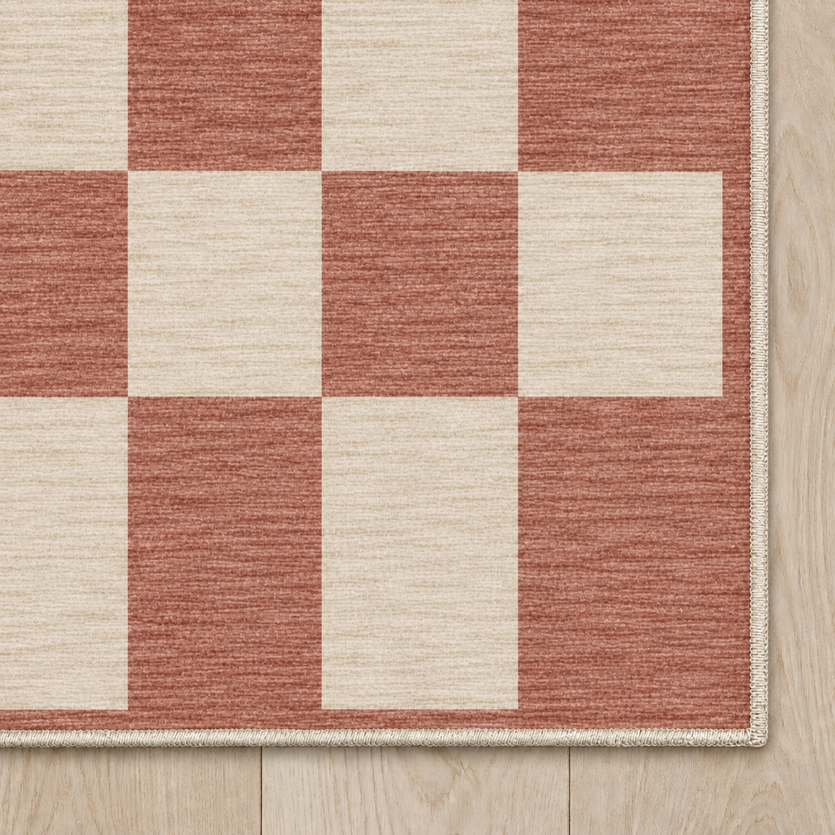 Top-down Apollo Sunday Check in Dusty Rose / Cream: chenille corner and cream serged edge — digital material visualization, not a finished-rug photograph.