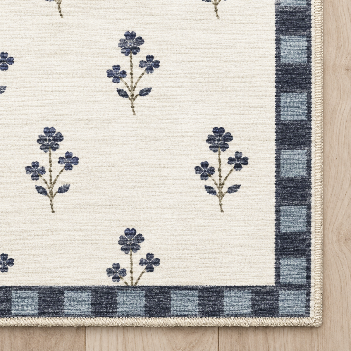 Top-down Apollo Posy Walk in Navy / Cream: chenille corner and cream serged edge — digital material visualization, not a finished-rug photograph.