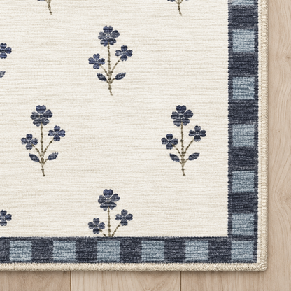 Top-down Apollo Posy Walk in Navy / Cream: chenille corner and cream serged edge — digital material visualization, not a finished-rug photograph.