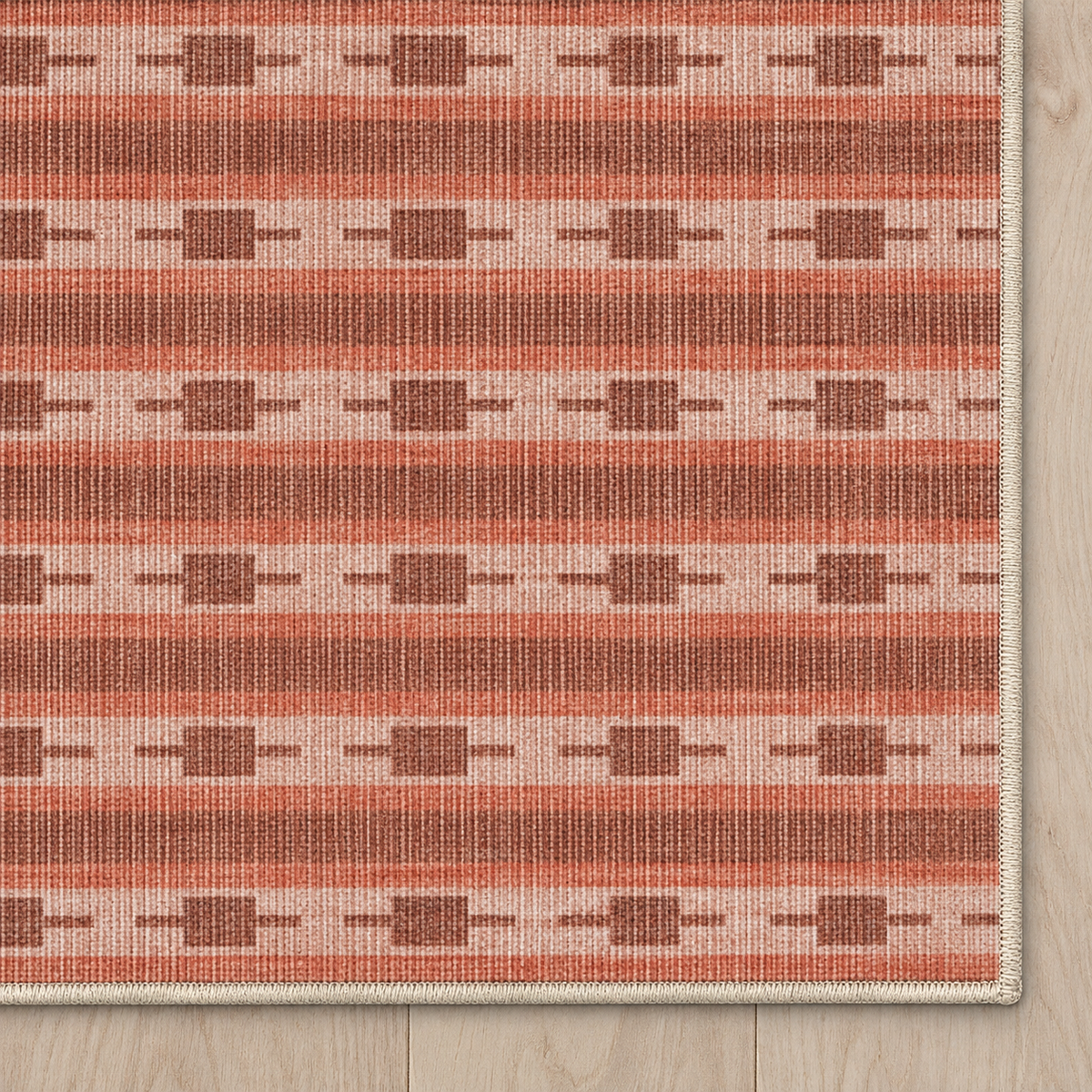 Top-down Apollo Keepsake Stripe in Terracotta / Light Terracotta: chenille corner and cream serged edge — digital material visualization, not a finished-rug photograph.
