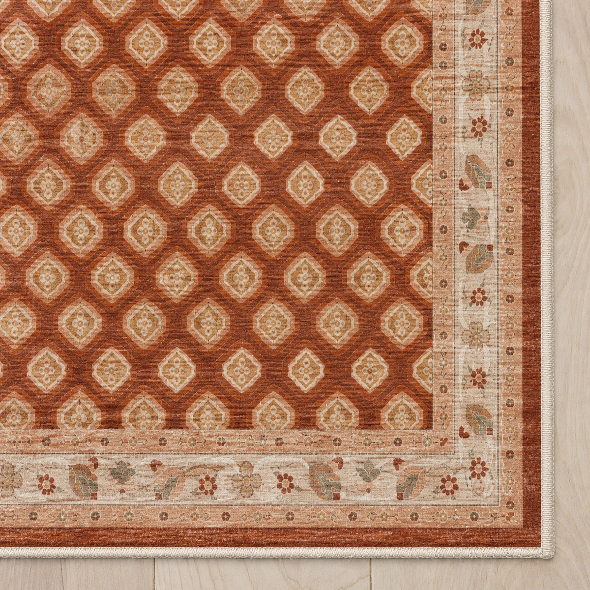Top-down Apollo Filigree Lane in Terracotta / Beige: chenille corner and cream serged edge — digital material visualization, not a finished-rug photograph.