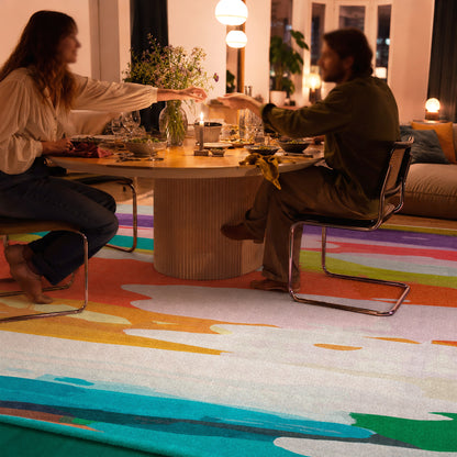 On Holiday rug by Claire Desjardins, styled in a room.
