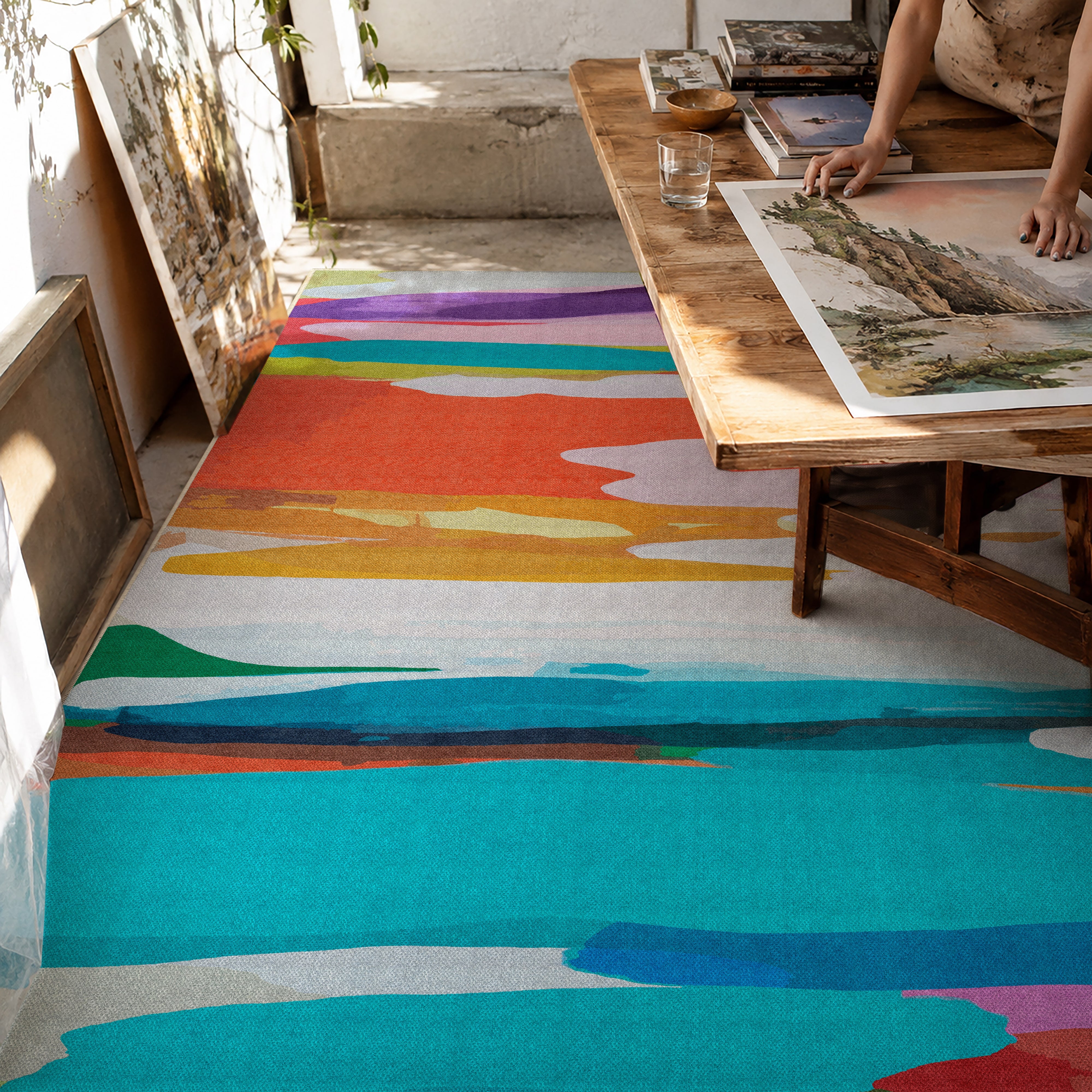 On Holiday rug by Claire Desjardins, styled in a room.